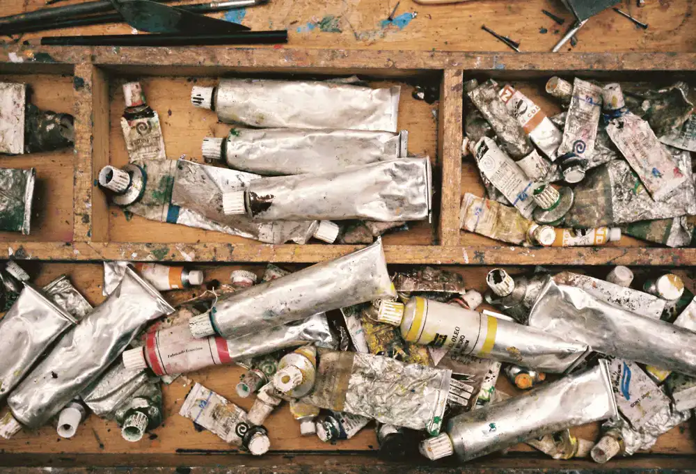 Studio workbench with paints and brushes
