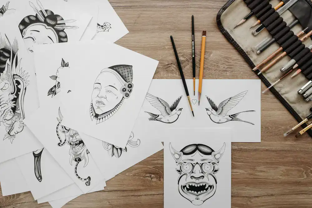 Pencil sketches and paper pounce patterns of sign layouts