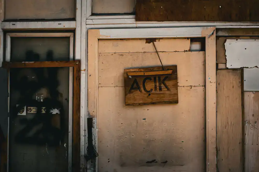 Freestanding wooden A-board with painted signs